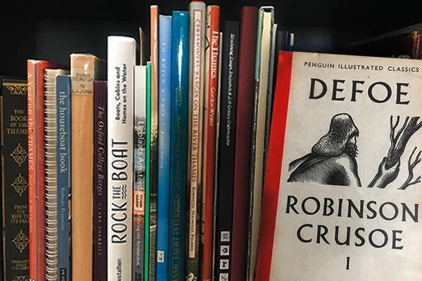 One of my bookshelves and Daniel Defoe's "Robinson Crusoe" - A real classic