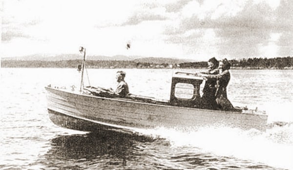 Period photo of one of the fast wooden motor dinghies.