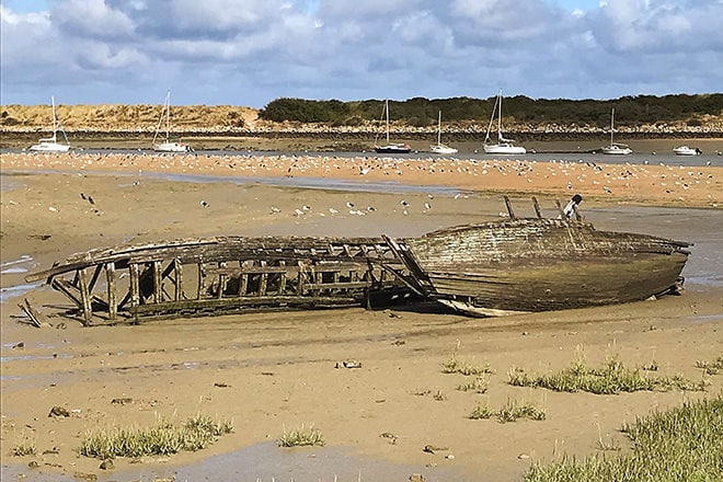 Boat remains on the beach in Normandie, France.