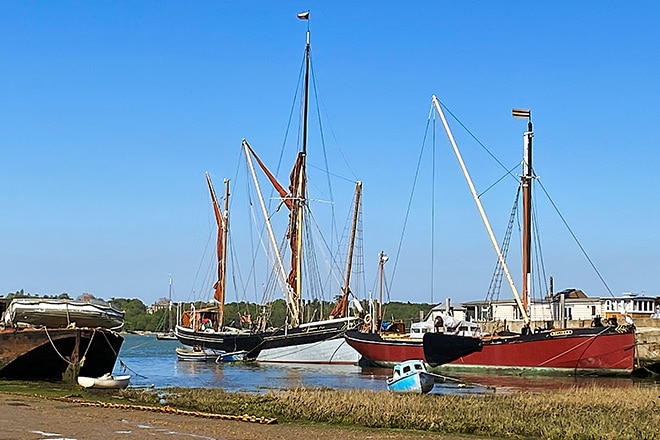 Thames sailing barges permanently moored by the Butt & Oyster Pub at Pin Mill.