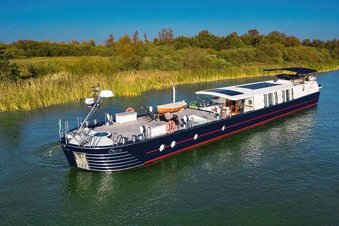 'Savvy' - an almost 30m long, award winning, yacht barge - for sale through HSC.