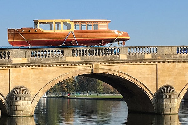 A gentleman's launch heading for its winter quarters by road.