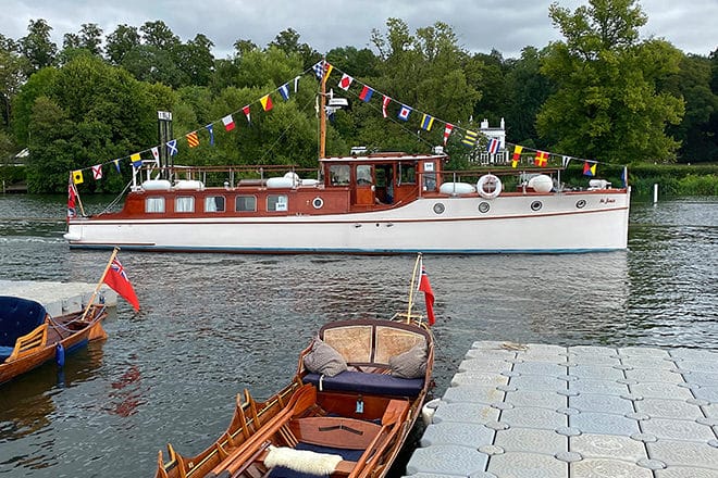 'St. Joan' - looking shipshape and beautifully decorated, with her owner Hannah at the helm.