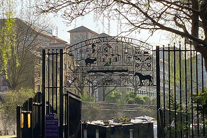 The gate to the Regent's Canal towpath and moorings in little Venice.