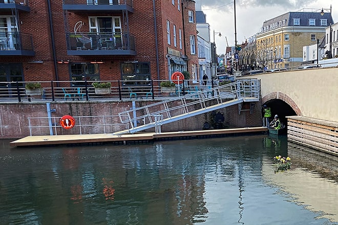 Workmen installing a jetty in the newly built canal in the centre of Maidenhead