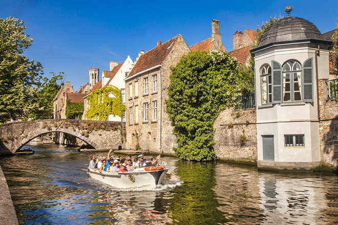 A visit to Bruges is not complete without a boat trip on Bruges' canals 
photo 'Visit Bruges' by Jan D'Hondt