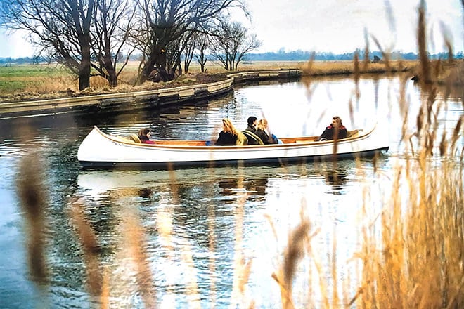 Rupert Latham at the helm of the first electric canoe in the early 90s.
