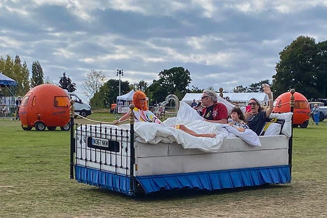 Lady McAlpine zooming around the exhibition ground on an electrified king-sized bed with Edd China at the helm.