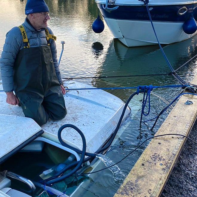 Steve on the roof of a boat that had sunk, making preparations for a big pump out which, we can now confirm, was successfully achieved by our ace boatyard team.
