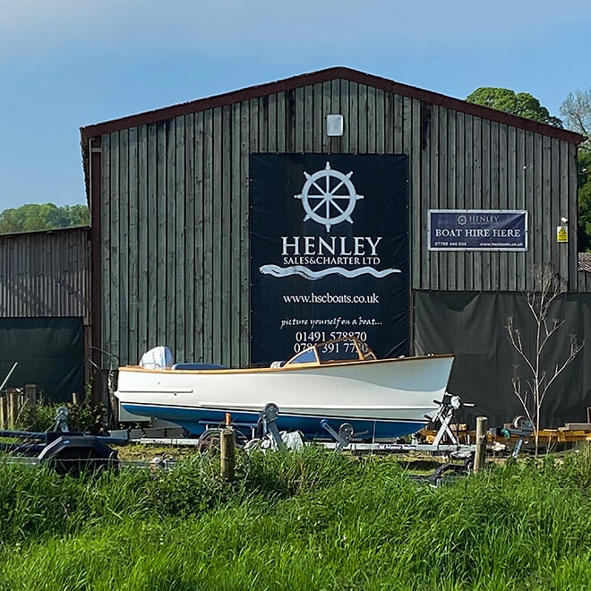 A Baycraft 19 gleaming in the sun on her trailer in front of our Beale Park boat store and yard.