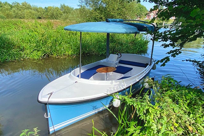 'Scoop II' - This electric boat is easy to drive, seats 7 and features a full canopy and transparent drop own sides.