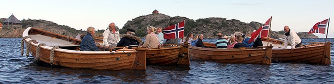 In a typically Norwegian summertime scene, Snekke enthusiasts enjoy a get-together during a raftup.