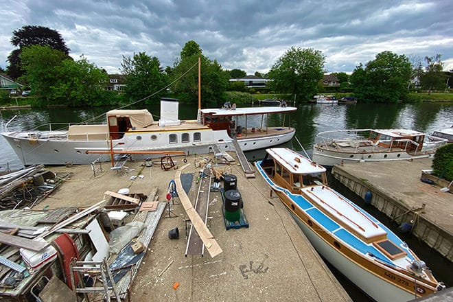 The elegant Camper and Nicholsons 'Llanthony' nearing completion at Dennett's boat yard. 'MB278' in the dock and 'Ona II' to the right of the photo, all sold by HSC.