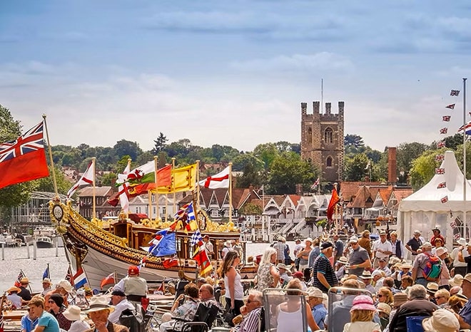 The Thames Traditional Boat Festival in full swing against the Henley-on-Thames backdrop.