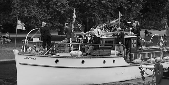 Veterans aboard 'Janthea', one of the Dunkirk Little Ships, honouring a legacy of courage and camaraderie.